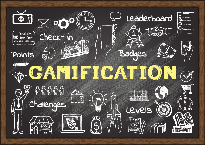 A blackboard image with words like gamification, leaderboard, points, levels and badges.