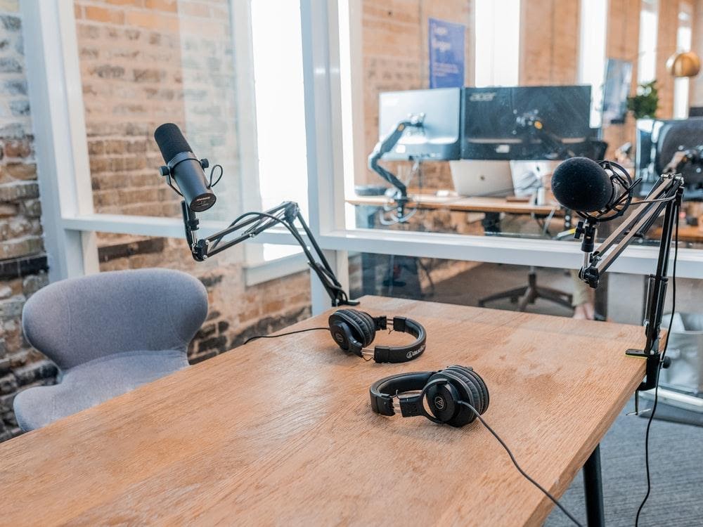 Image of studio recording equipment including headphones and microphones.